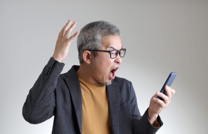 Man shouting into a phone